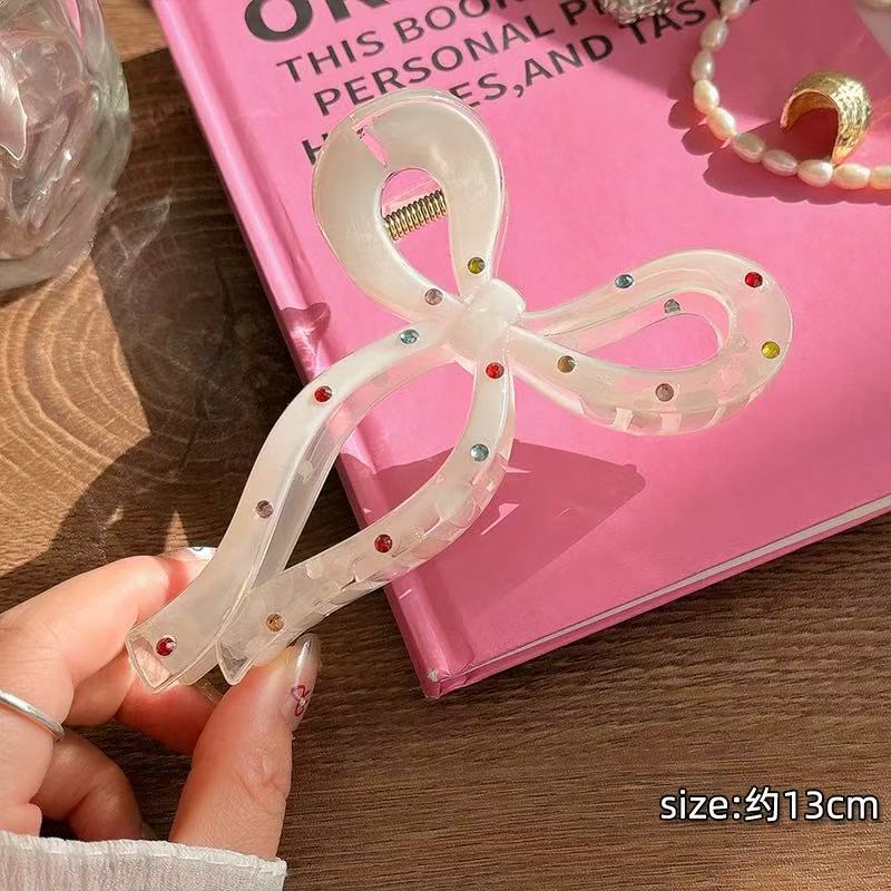 CuteHart Star Bow Shaped Hair Claw Clip - Sparkling Milky White Rhinestone Design 1pc 闪耀彩钻装饰的奶白色星形蝴蝶结抓夹